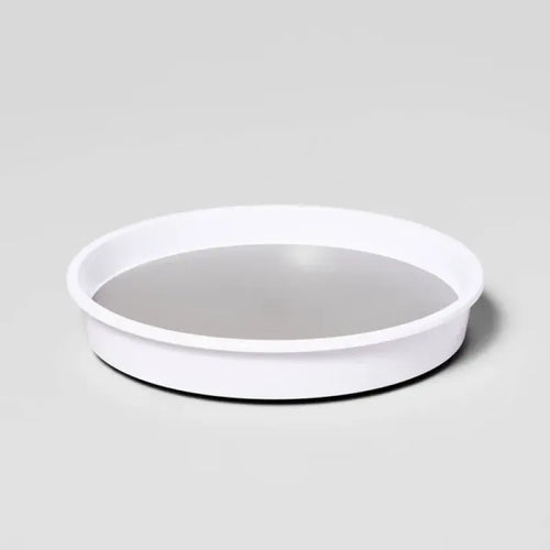 White circular organizer with raised rim and gray non-slip surface