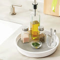 White and gray 10-inch rotating organizer holding kitchen essentials on a counter